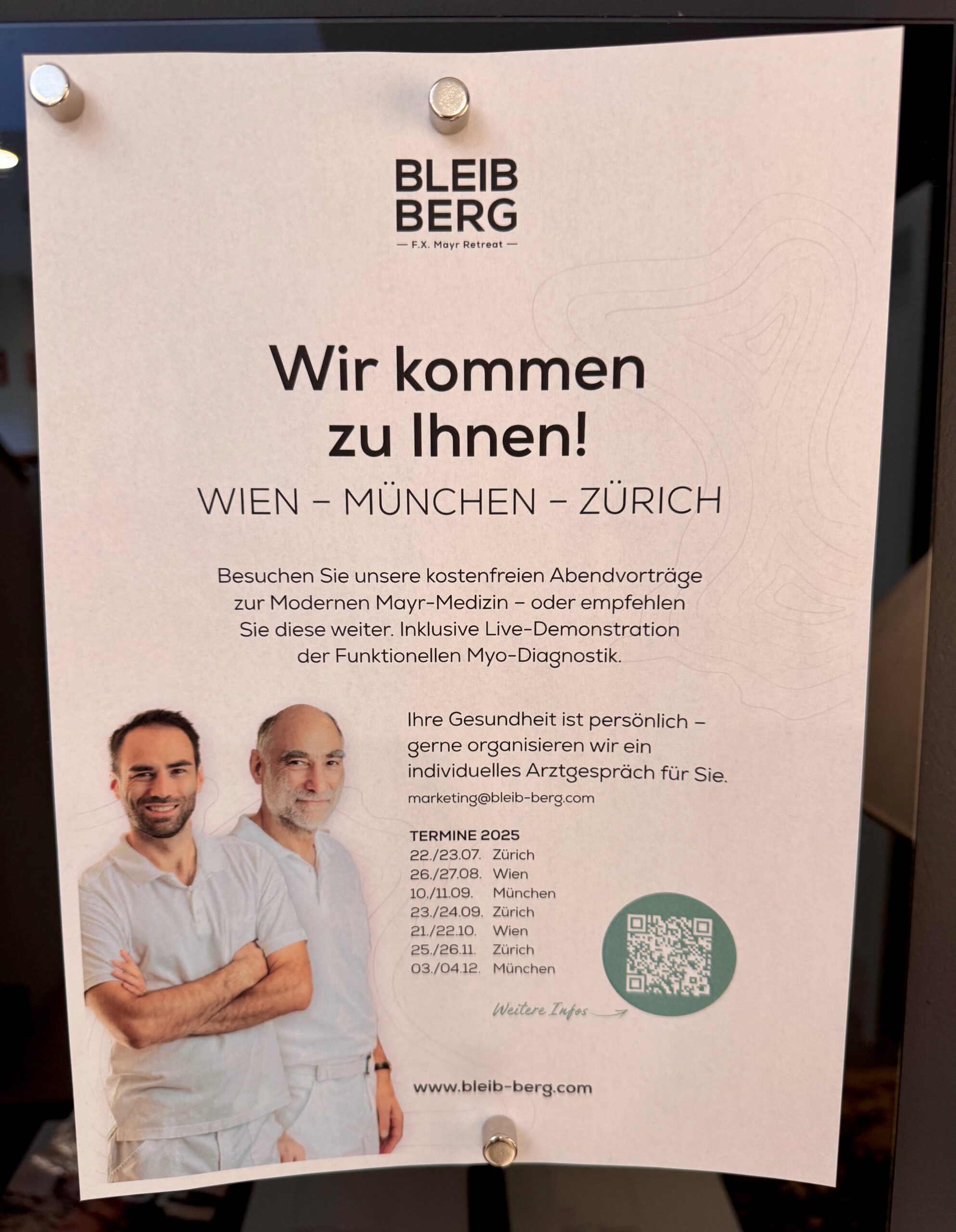 a sign with a couple of men